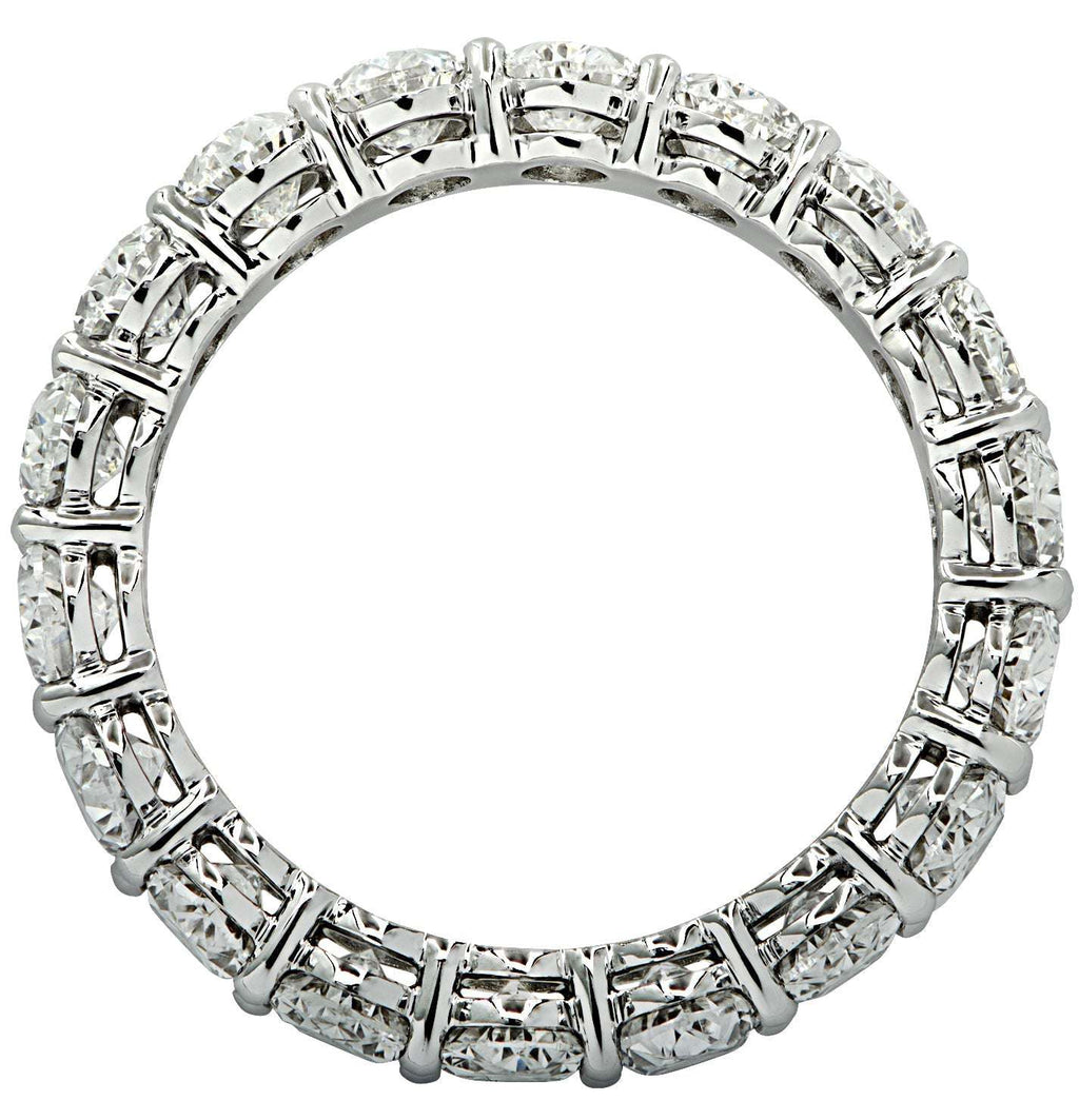 Vivid Diamonds GIA Certified 7.55 Ct Oval Cut Diamond Eternity Band in Platinum featuring a seamless design of 15 oval cut diamonds elegantly set, radiating brilliance and sophistication. Perfect for showcasing luxury and timeless style.