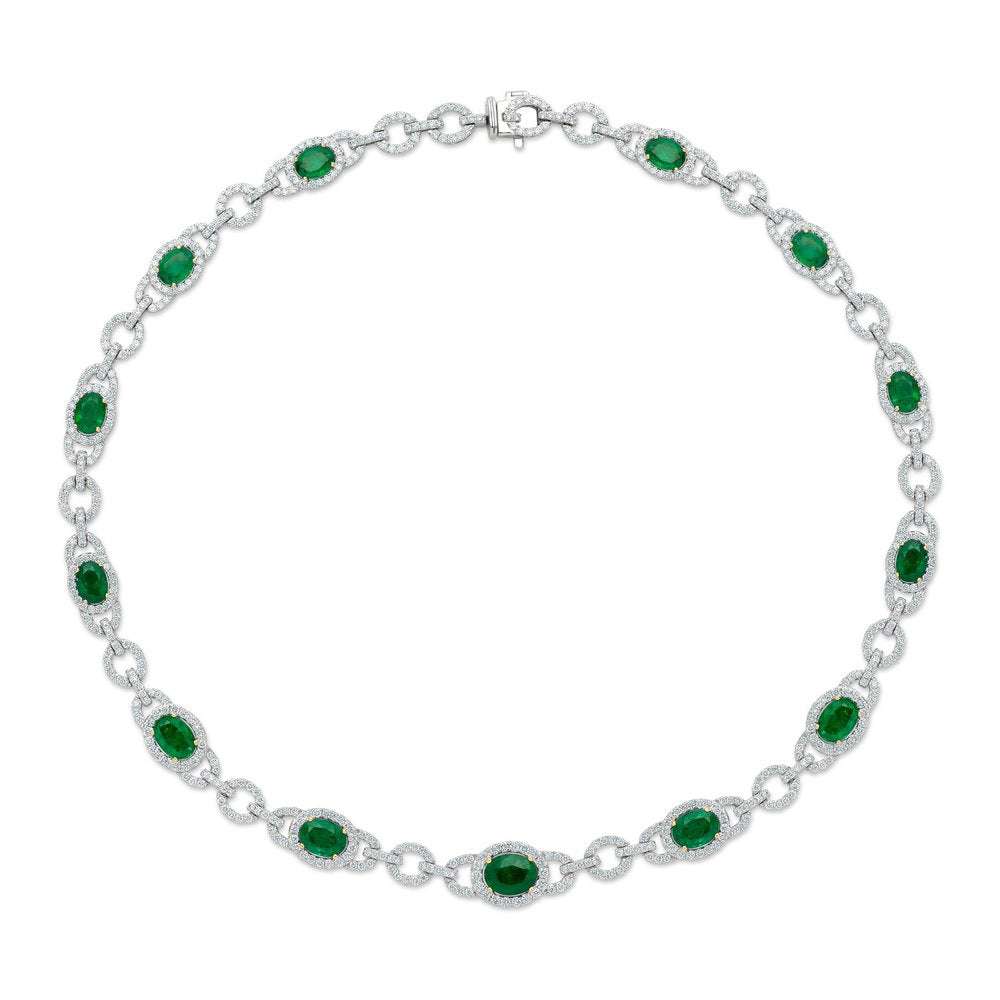 Elegant 18K White Gold Diamond and Emerald Necklace, showcasing a harmonious layout of emeralds and diamonds. Crafted by Vivid Diamonds, this piece totals 12.28 carats of emeralds and 7.92 carats of diamonds, embodying luxury and refinement.