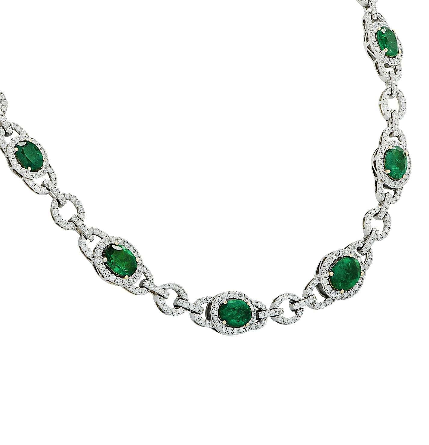 Close-up view of the 18K White Gold Diamond and Emerald Necklace by Vivid Diamonds, highlighting the exquisite emeralds and diamonds. An elegant accessory perfect for sophisticated occasions, weighing 12.28 carats of emeralds and 7.92 carats of diamonds.