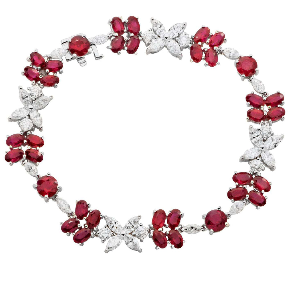 Exquisite Ruby & Diamond Floral Bracelet in 18K White Gold by Vivid Diamonds, showcasing vibrant red rubies and brilliant-cut diamonds in a captivating floral design.