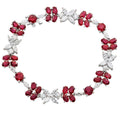 Exquisite Ruby & Diamond Floral Bracelet in 18K White Gold by Vivid Diamonds, showcasing vibrant red rubies and brilliant-cut diamonds in a captivating floral design.