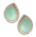Elegant David Webb Turquoise Earrings featuring a stunning cabochon-cut turquoise stone, surrounded by sparkling 2.47 ct diamonds in a luxurious platinum and 18K yellow gold setting. Exquisite jewelry design by Vivid Diamonds.