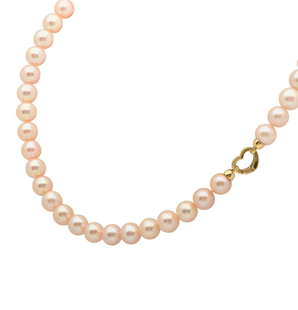Elegant Pearl Necklace showcasing lustrous pearls and an intricate 18K yellow gold heart clasp, a timeless jewelry piece by Vivid Diamonds.