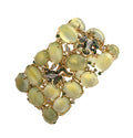 Enchanting 18K Yellow Gold Moonstone Frog Bangle with Diamonds & Tsavorites by Vivid Diamonds, showcasing a whimsical frog design adorned with lustrous moonstones and sparkling diamonds.