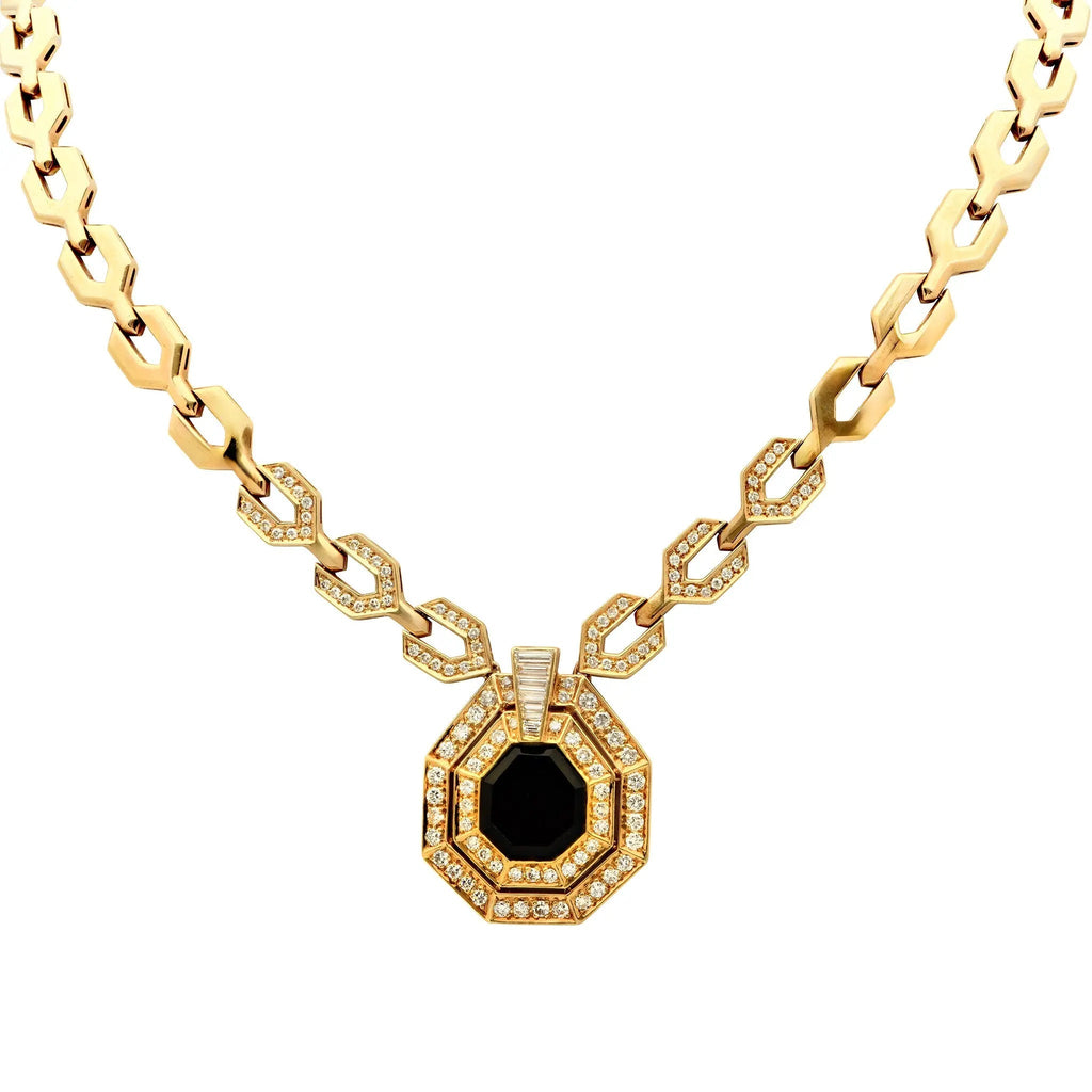 Stunning 18K yellow gold necklace featuring a geometric design adorned with 3.60 carats of diamonds and onyx, crafted by Vivid Diamonds. A luxurious statement piece that embodies modern elegance.