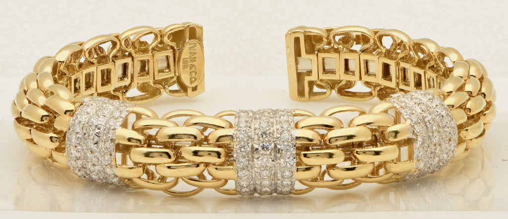 Stunning 18k Yellow & White Gold Diamond Link Bracelet with 2.00ct Round Brilliants from Vivid Diamonds, highlighted by its intricate structure and brilliant sparkle.