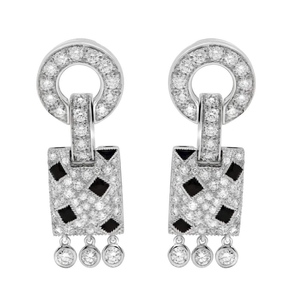 Close-up view of the Cartier Panthère 54 Earrings by Vivid Diamonds, featuring intricate design in 18K white gold adorned with brilliant-cut diamonds and striking black onyx elements.