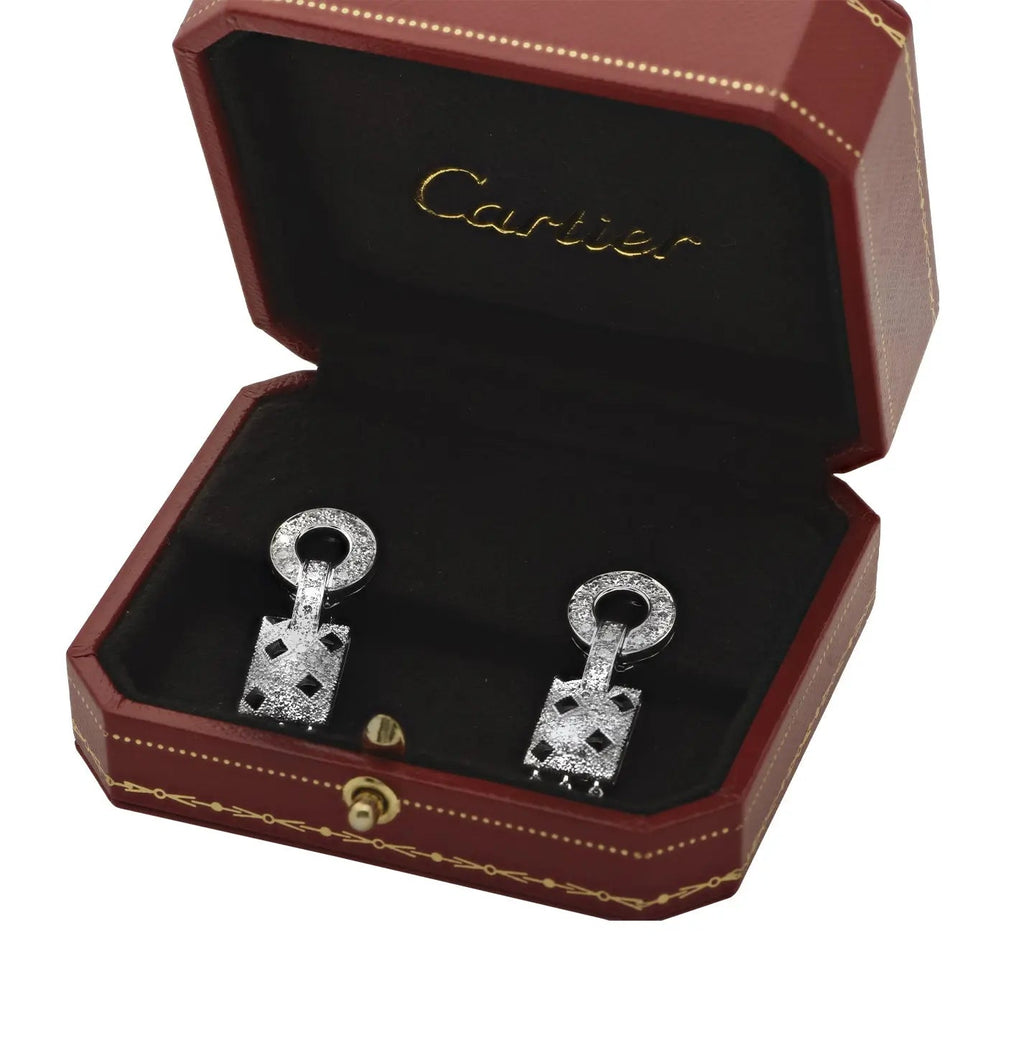 Cartier Panthère 54 Earrings displayed in an elegant red Cartier box, showcasing the luxurious craftsmanship of Vivid Diamonds in 18K white gold with dazzling diamonds and black onyx accents.