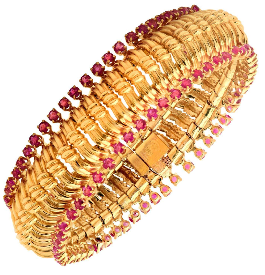 Exquisite Radiant Burma Ruby Bracelet featuring intricate 18K gold craftsmanship and adorned with 102 diamonds, presented by Vivid Diamonds.
