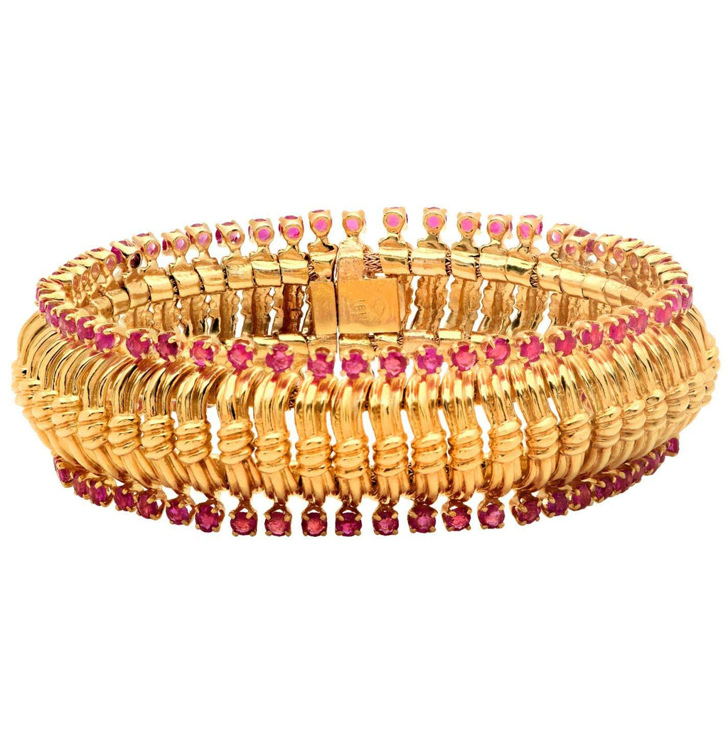 Stunning aerial view of the Exquisite Radiant Burma Ruby Bracelet in 18K gold with 102 diamonds, highlighting its luxurious design, available from Vivid Diamonds.