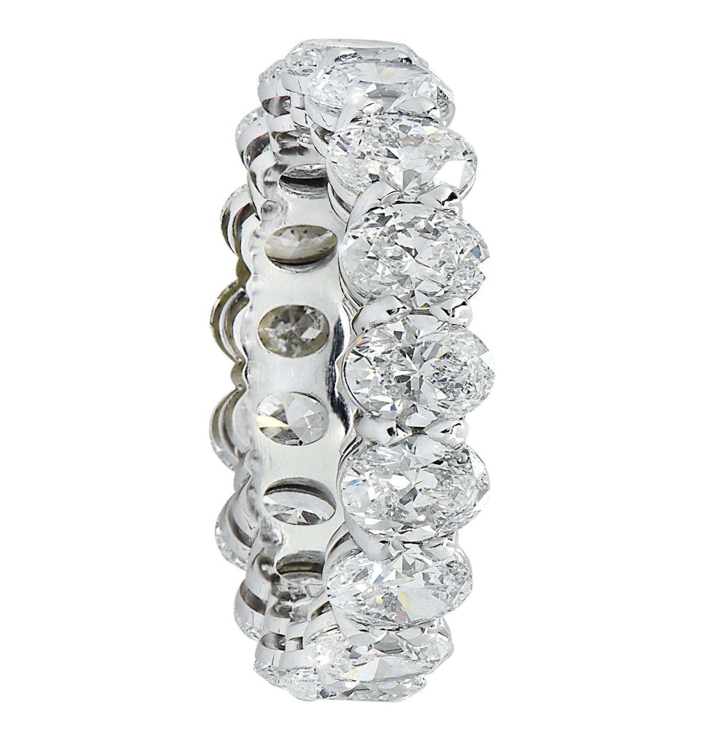 Vivid Diamonds 4.39 Ct Platinum Diamond Eternity Band viewed from the side, featuring 18 radiant oval cut diamonds in a stunning arrangement.