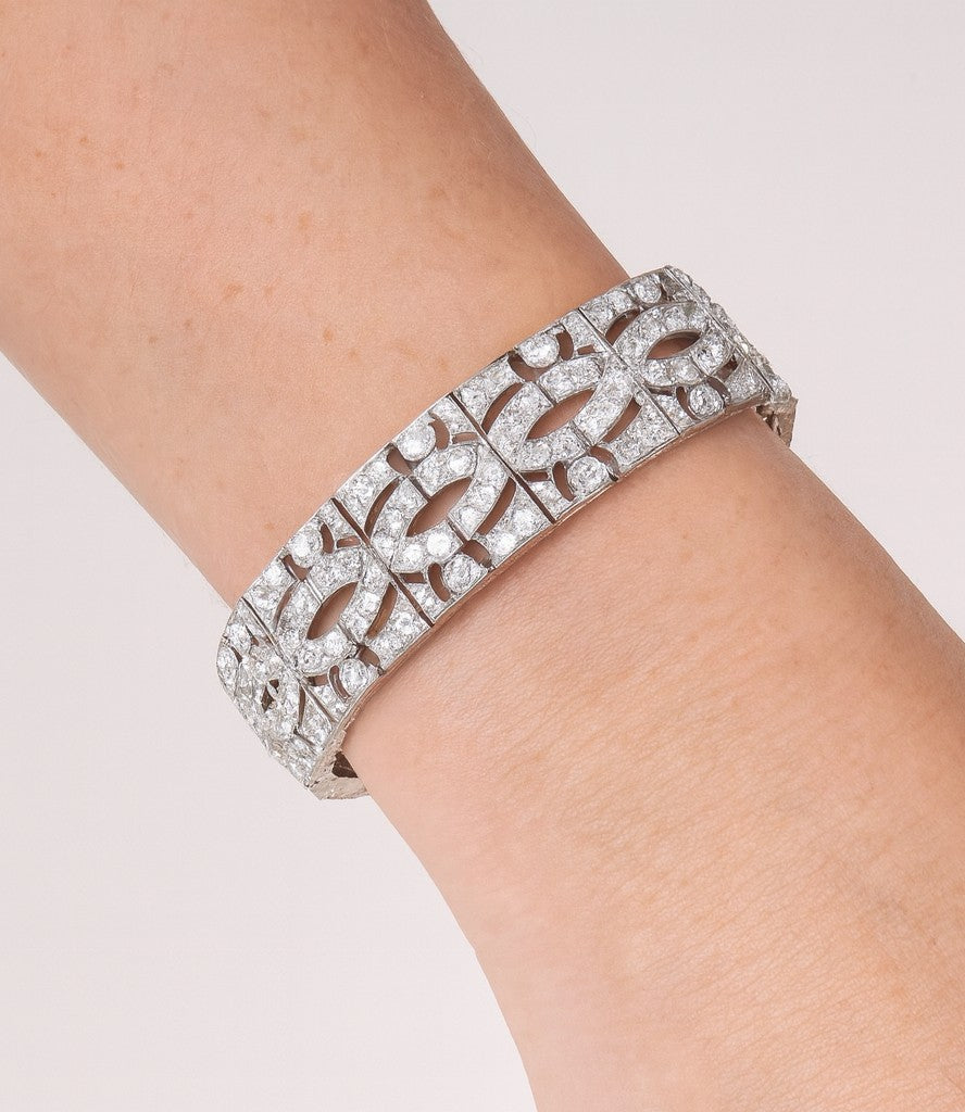 Luxury 11ct Platinum French-Style European Cut Diamond Bracelet by Vivid Diamonds worn on a wrist, highlighting its exquisite craftsmanship and timeless style.