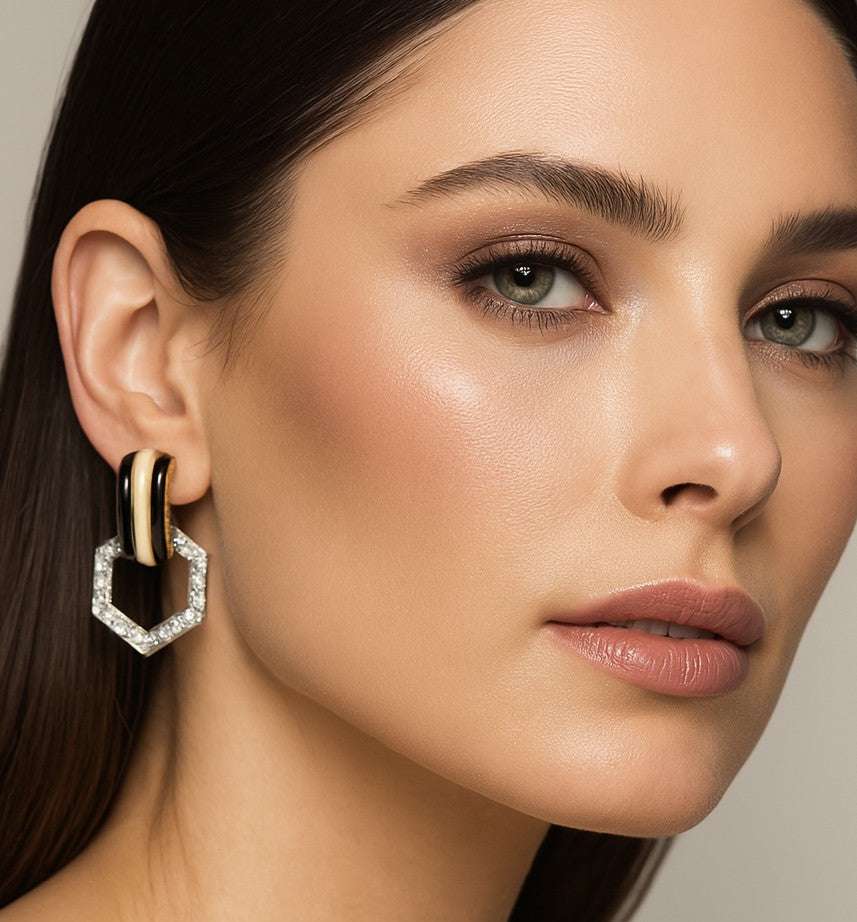 A model elegantly wearing David Webb 2.79 Ct Diamond, Platinum & 18K Yellow Gold Enamel Earrings, highlighting their sophisticated style and luxurious craftsmanship by Vivid Diamonds.