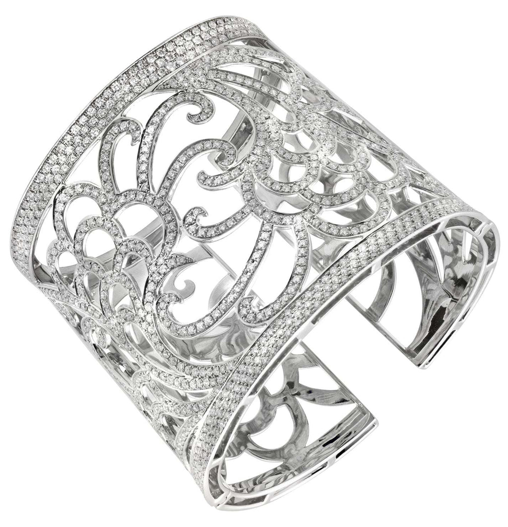 Exquisite Italian 18K White Gold Wide Open Work Cuff Bangle featuring 6 Carat Round Brilliant Cut Diamonds by Vivid Diamonds. This luxurious jewelry piece showcases intricate open-work design, highlighting the brilliant sparkle of diamonds with contempora