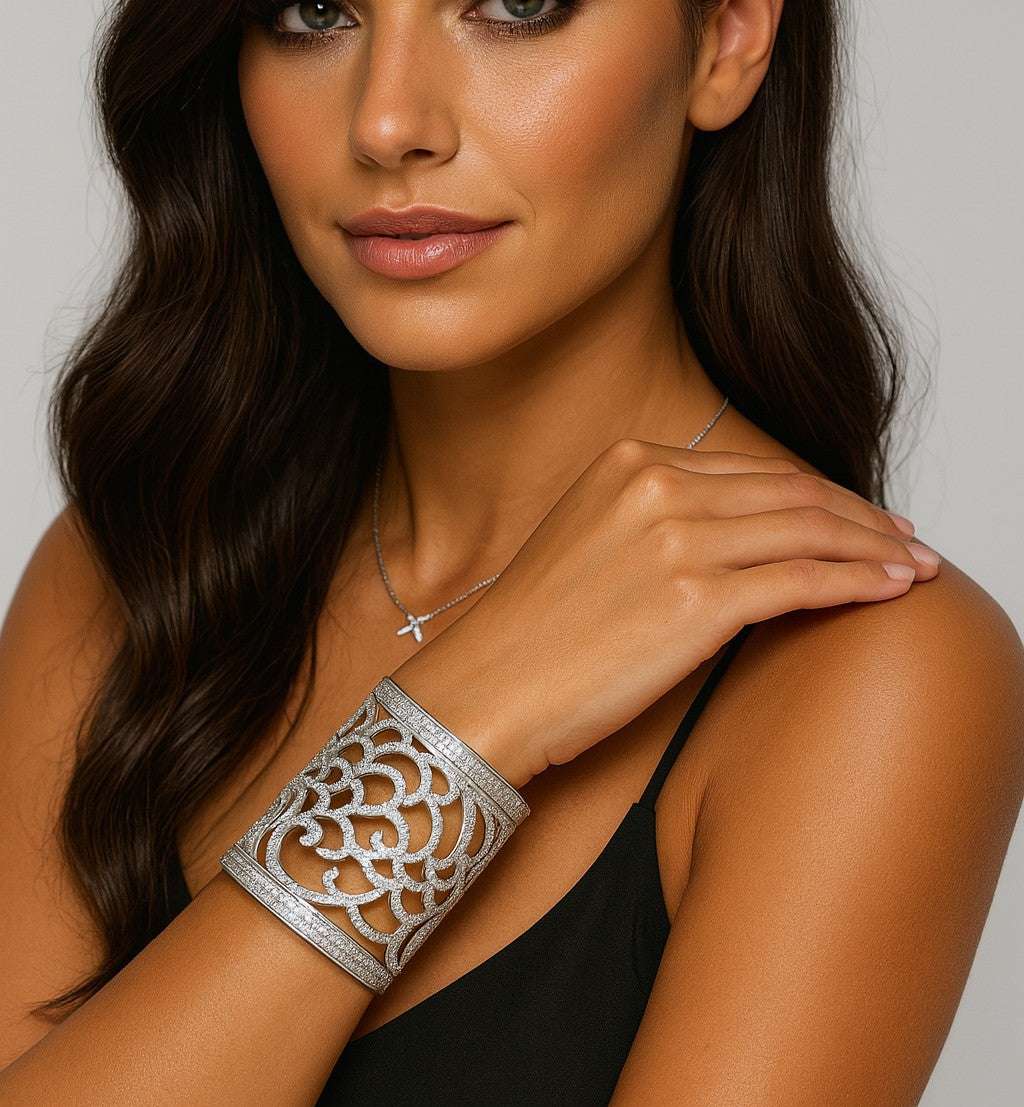 Elegant model showcasing the Italian 18K White Gold Wide Open Work Cuff Bangle adorned with 6 Carat Round Brilliant Cut Diamonds by Vivid Diamonds, highlighting its exquisite design and luxurious appeal.