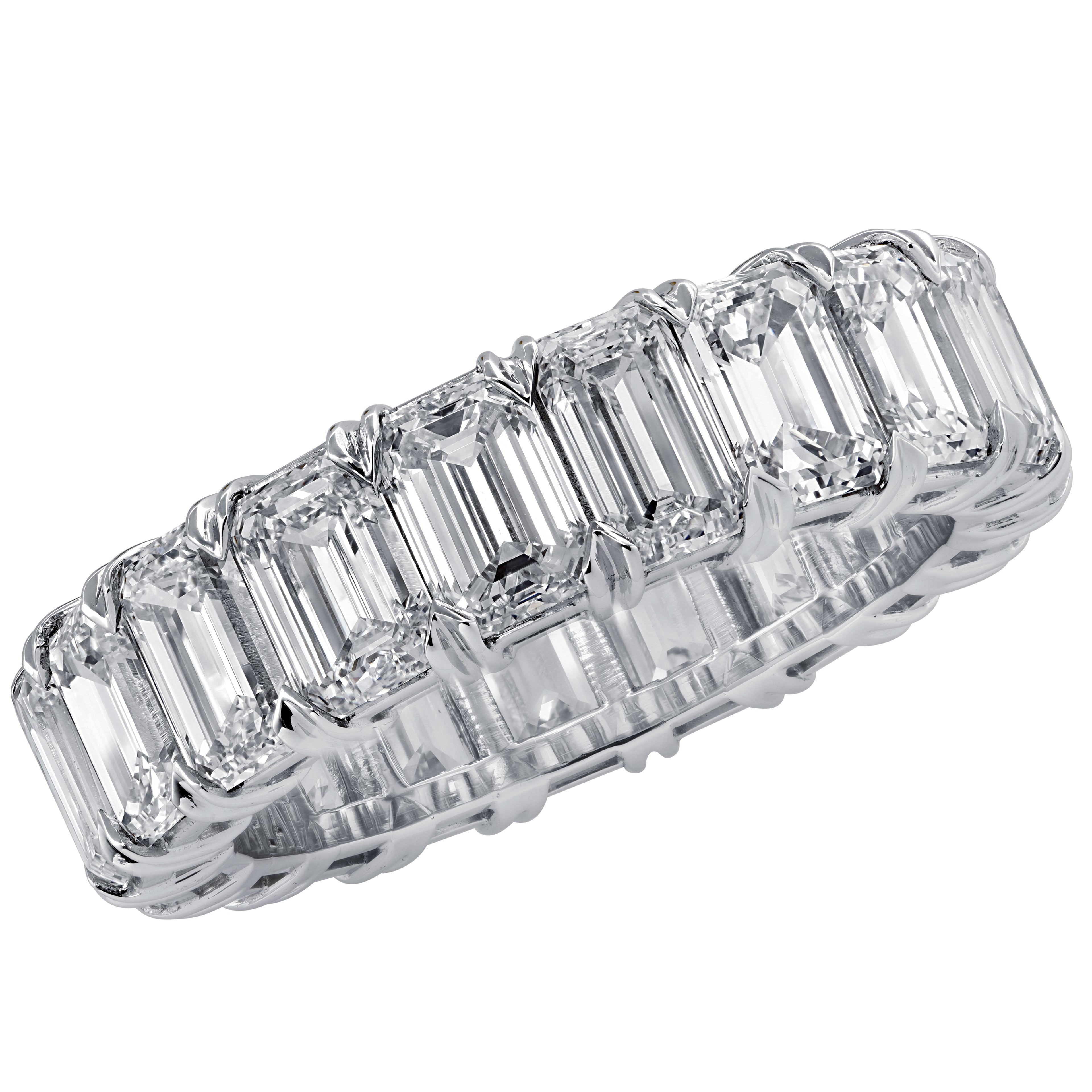 Vivid Diamonds 6.23 Ct Emerald Cut Diamond Eternity Band in Platinum showcasing 18 pristine emerald cut diamonds, symbolizing timeless elegance and luxury craftsmanship.